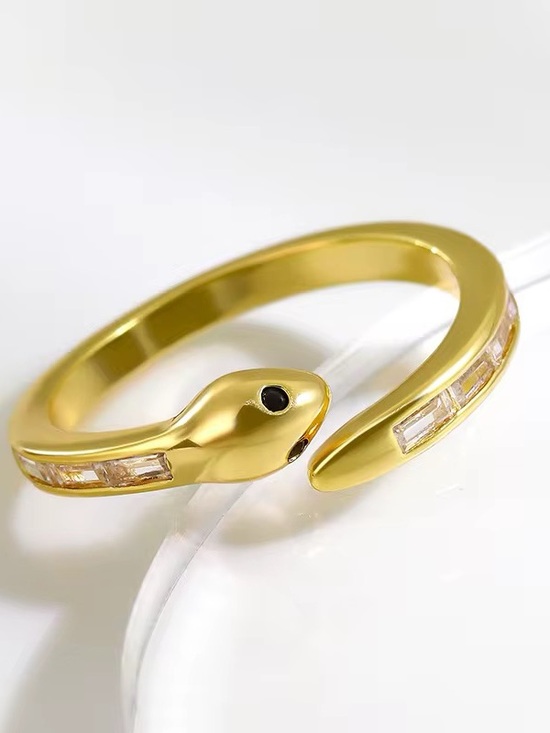 Lavish Jewelry Jewelry - Vintage-Inspired Golden Snake Ring | Baguette Stones & Black eye stone.